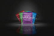 Assorted packages of Paz berry frost with colorful packaging on a white background